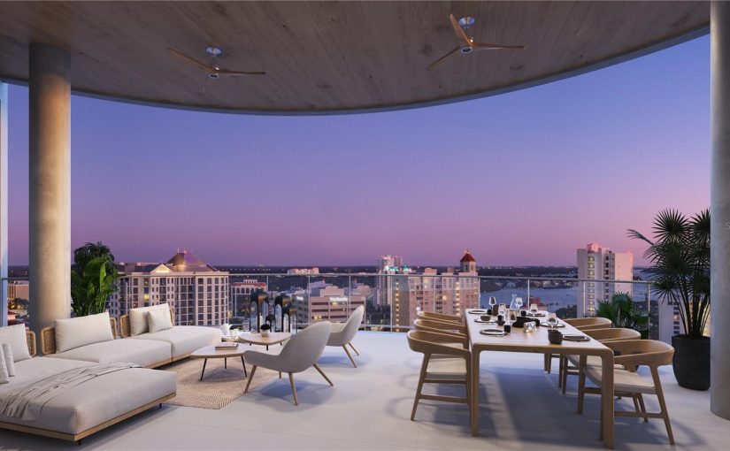 Luxurious rooftop terrace at The Edge condominiums in downtown Sarasota with panoramic sunset views over the city skyline and Sarasota Bay.